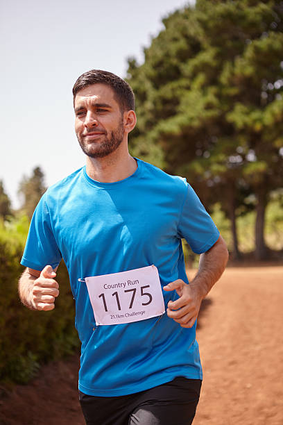 istock Young male runner in a race 580108140