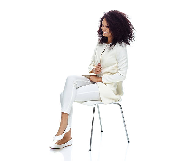 istock Cheerful woman sitting and looking away 580108150