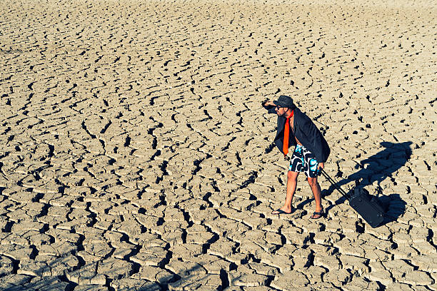 istock young traveler walking through the desert 580108902