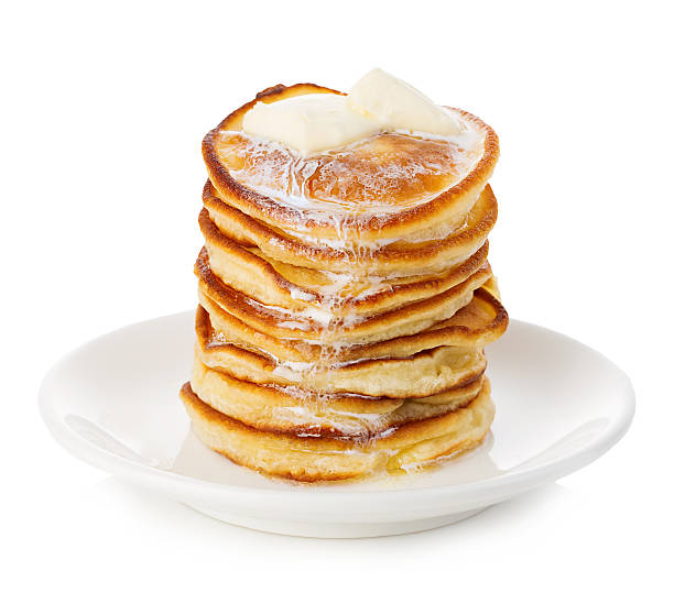 istock Stack of delicious pancakes with butter on plate isolated. 580109174