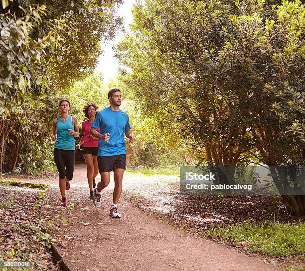 Three young friends jogging for fun
