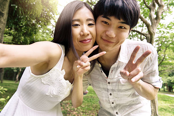 istock Japanese Couple doing selfie 580111140