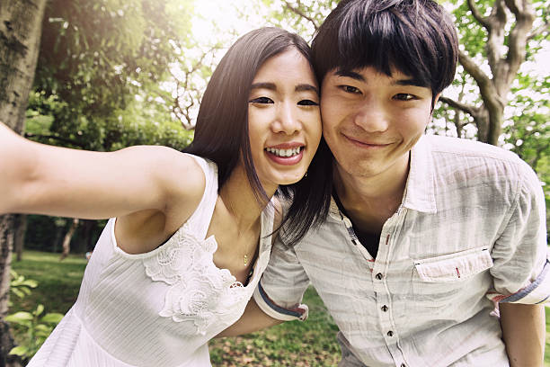 istock Japanese Couple doing selfie 580111260