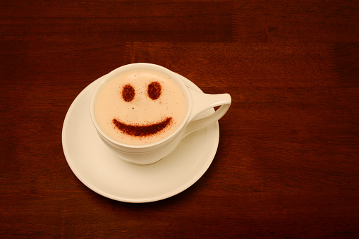 Cup of coffee with a smiley face