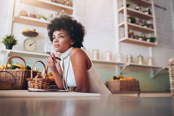 istock Young african female juice bar owner 580115846