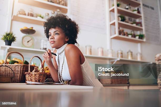 Young African Female Juice Bar Owner Stock Photo - Download Image Now - Contemplation, Owner, Small Business