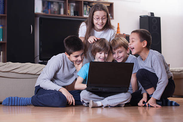 istock Children having fun with laptop 580116562