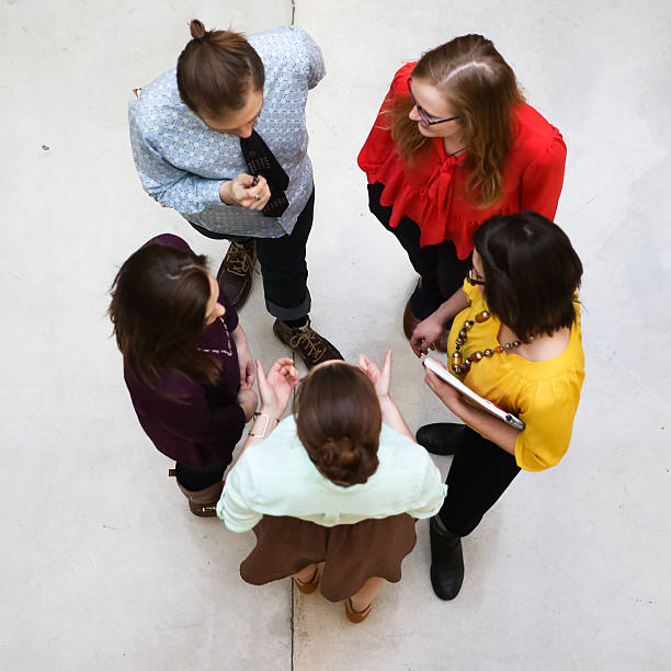 istock Group of Students or Young Business People Discussing Projects Plans 580119420