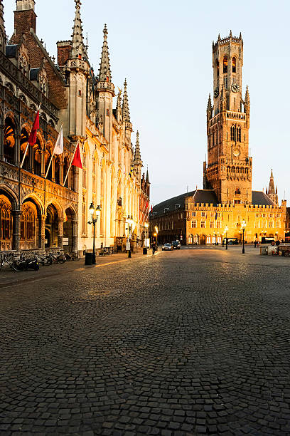 istock Ancient medieval tower with clock in The belfry of Bruges 580119932