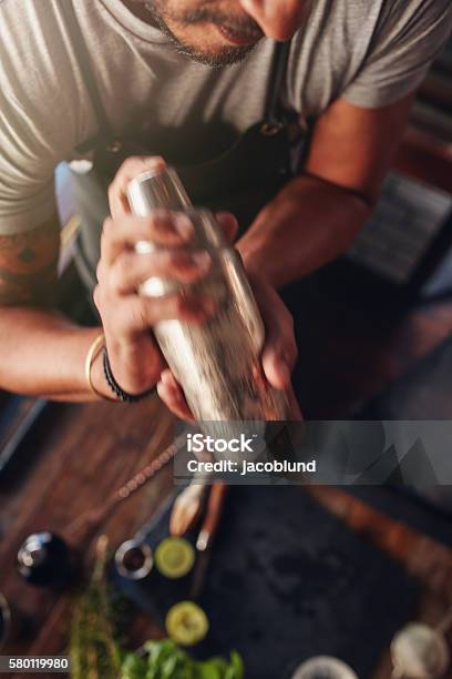 Bartender Mixing Drink In Cocktail Shaker Stock Photo - Download Image Now - Cocktail Shaker, Cocktail, Shaking