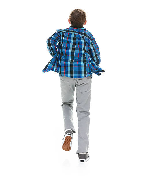istock Rear view of little boy running 580120370