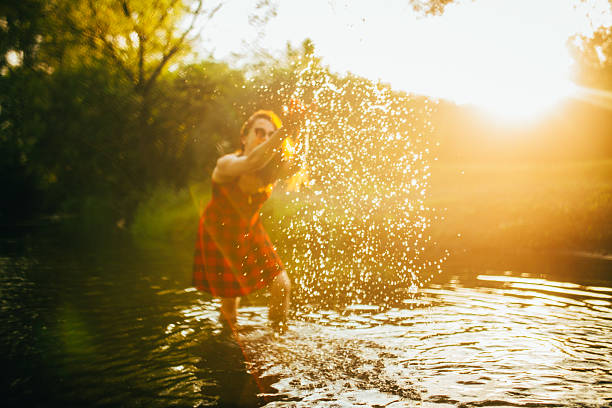 istock Woman enjoys the river 580121104
