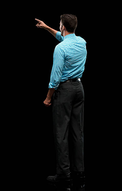 istock Rear view of businessman pointing away 580121628