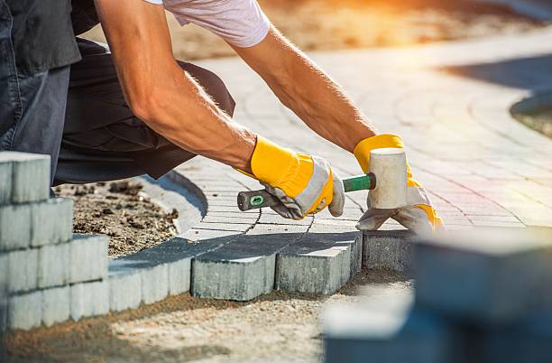 Garden Brick Pathway Paving Garden Brick Pathway Paving by Professional Paver Worker. cobblestone stock pictures, royalty-free photos & images