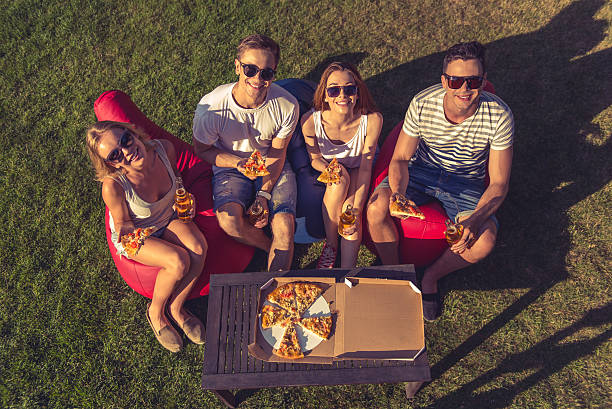 young people resting outdoors - usa restaurant flower bed beauty in nature imagens e fotografias de stock