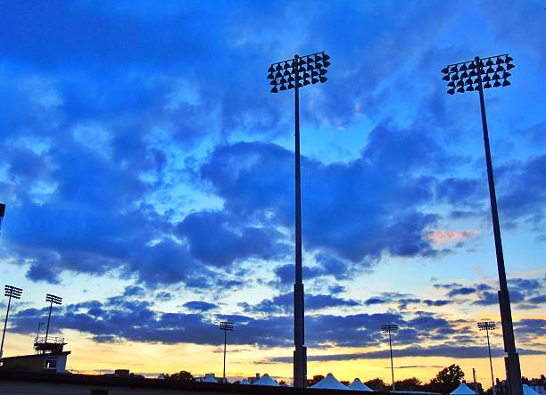 istock Sports ground floodlights at sunset 580123140