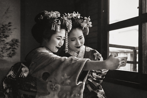 Maiko girls taking selfie