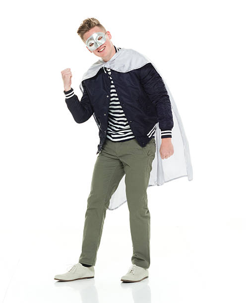 istock Smiling male superhero cheering 580123844