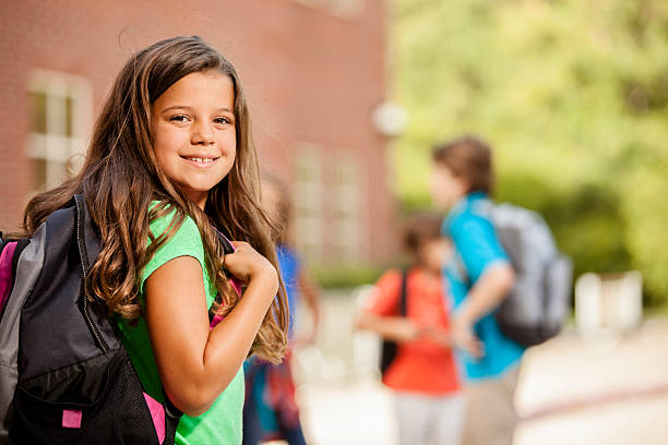 istock Back to School:  Elementary-age children, girl on school campus. 580125630