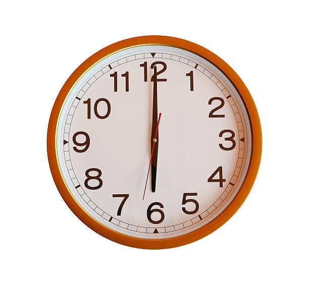 istock orange wall clock isolated in six o'clock. 580126482