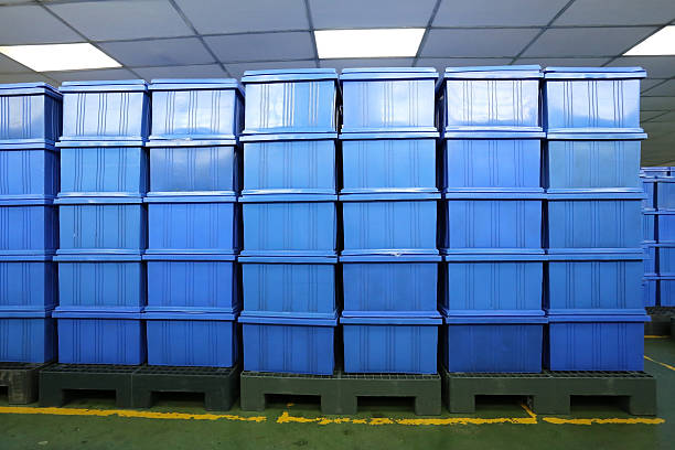 istock blue Plastic box products in Industrial factory room. 580127208