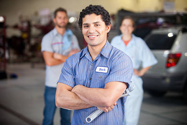 istock Auto Mechanic Team in Shop 580127716