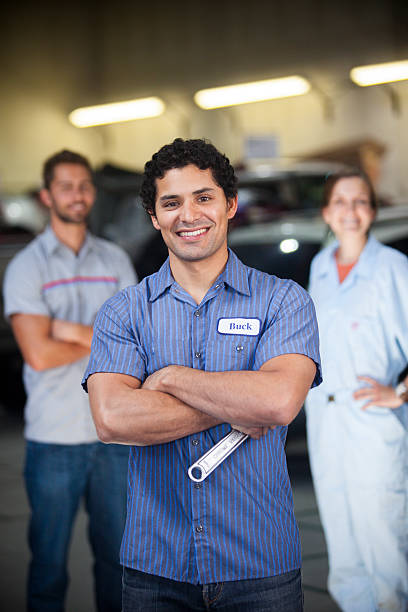 istock Auto Mechanic Team in Shop 580127724