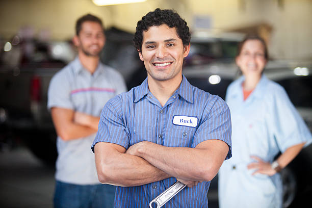 istock Auto Mechanic Team in Shop 580127728