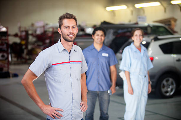 istock Auto Mechanic Team in Shop 580127738
