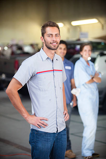 istock Auto Mechanic Team in Shop 580127780
