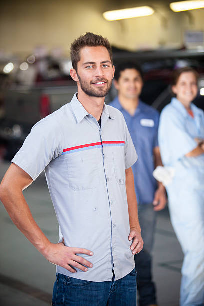 istock Auto Mechanic Team in Shop 580127782
