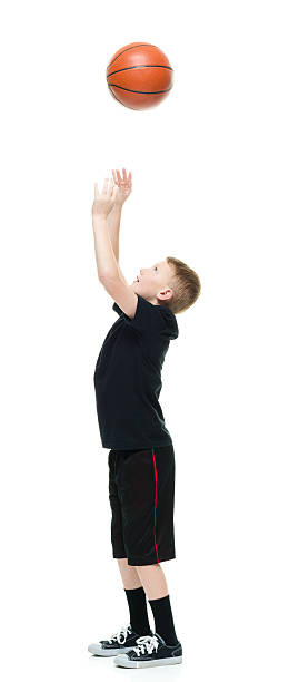 istock Little boy playing with basketball 580128048