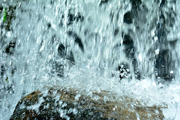 Part of moving water falling on the rock, beautiful waterfall