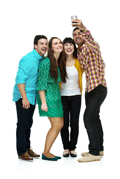 istock Smiling four friends taking a selfie 580130420