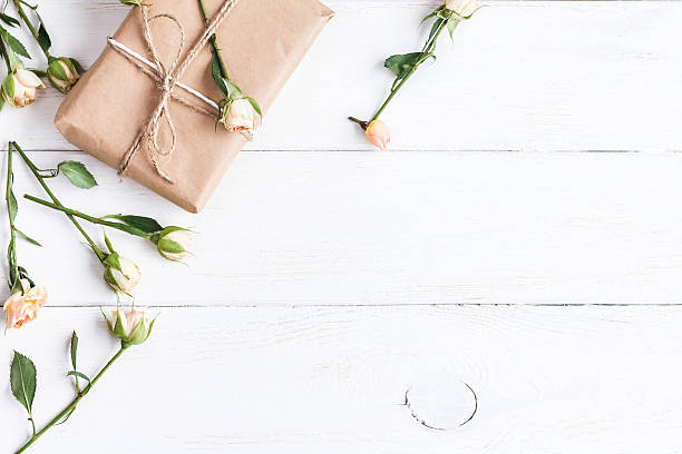 istock Gift and rose flowers. Top view, flat lay 580130588