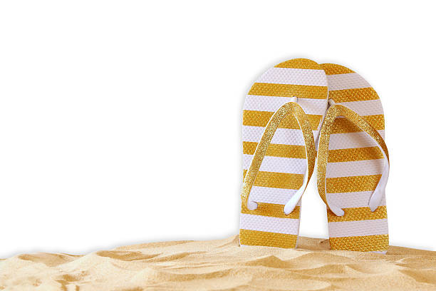 istock Image of tropical sandy beach and flip flops 580132086