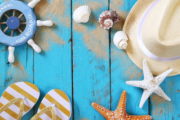 istock Top view nautical concept with fedora hat and seashells 580132194