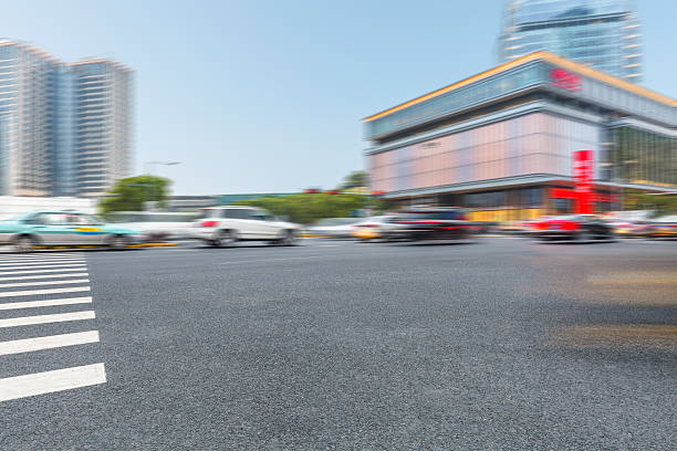 istock car driving on road in city 580132886