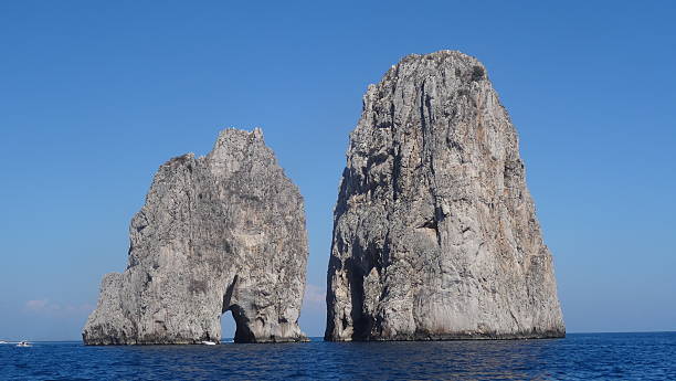 istock Rocks sticking out of ocean 580134748