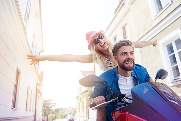 istock Young couple during the riding a scooter 582256208