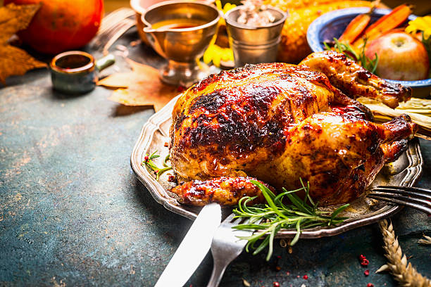 istock Roasted whole turkey or chicken on festive rustic table 582257602