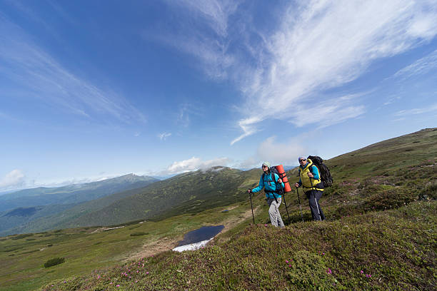 istock Summer hiking in the mountains with a backpack . 582258316