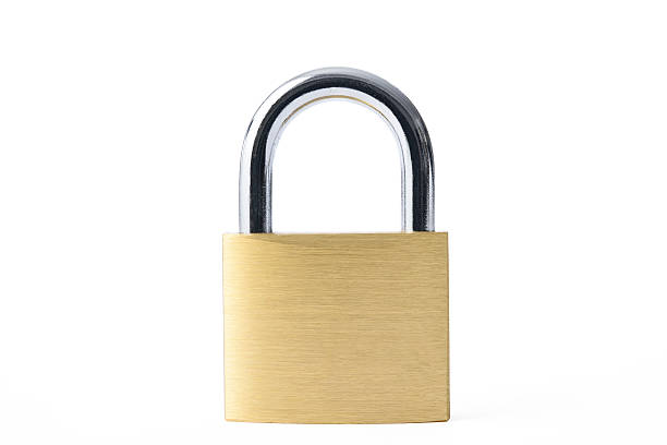 istock Isolated shot of locked new padlock on white background 582259926