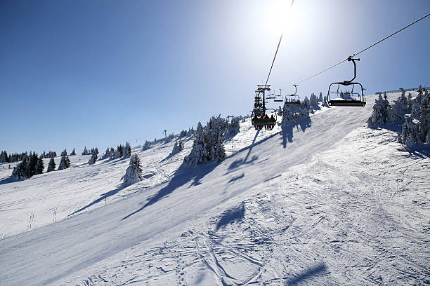 istock Ski chair lift moving 582260544