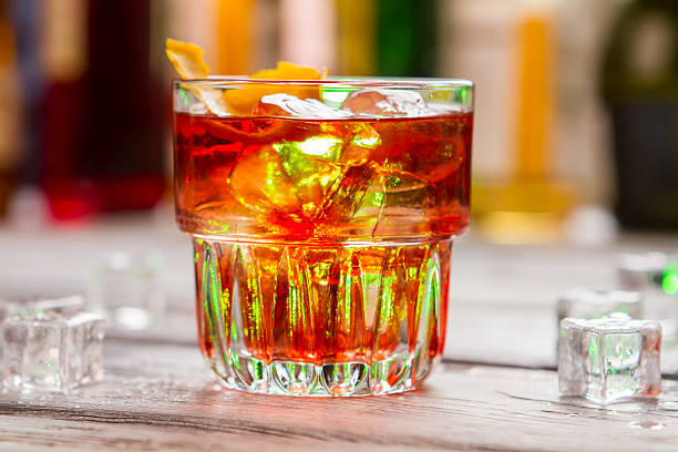istock Glass with dark orange beverage. 582262804