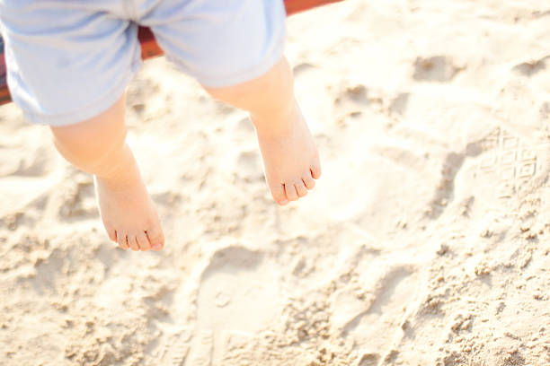 istock Baby legs, Playground, Sand 582263242
