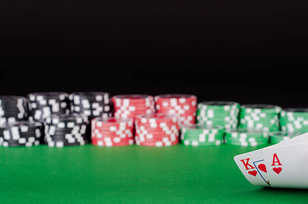 istock king, ace, black, red and green casino chips on table 582263288