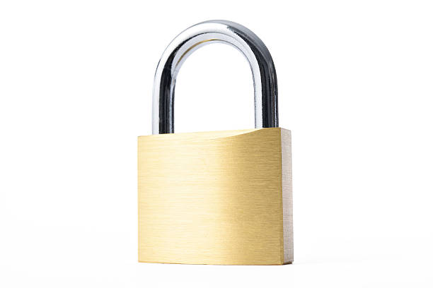 istock Isolated shot of locked new padlock on white background 582265774