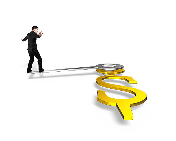 istock businessman walk on clock hands in USD dollar sign 582265786