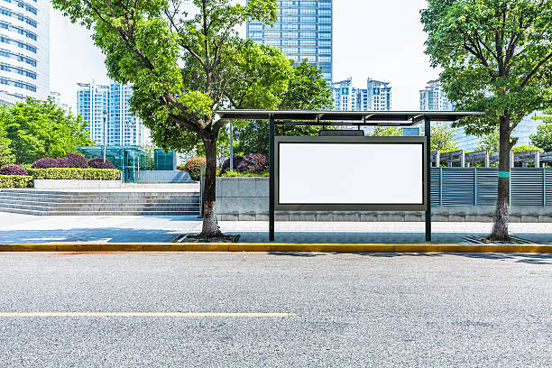 istock clean road with bus stop and modern buildings background 582267566